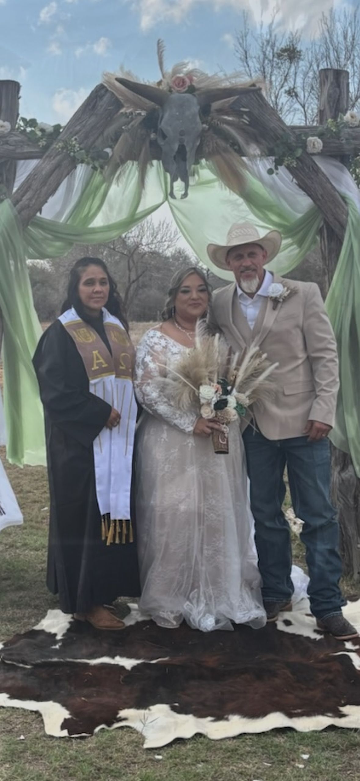 Julia Guerra officiating an outdoor wedding ceremony in West Texas